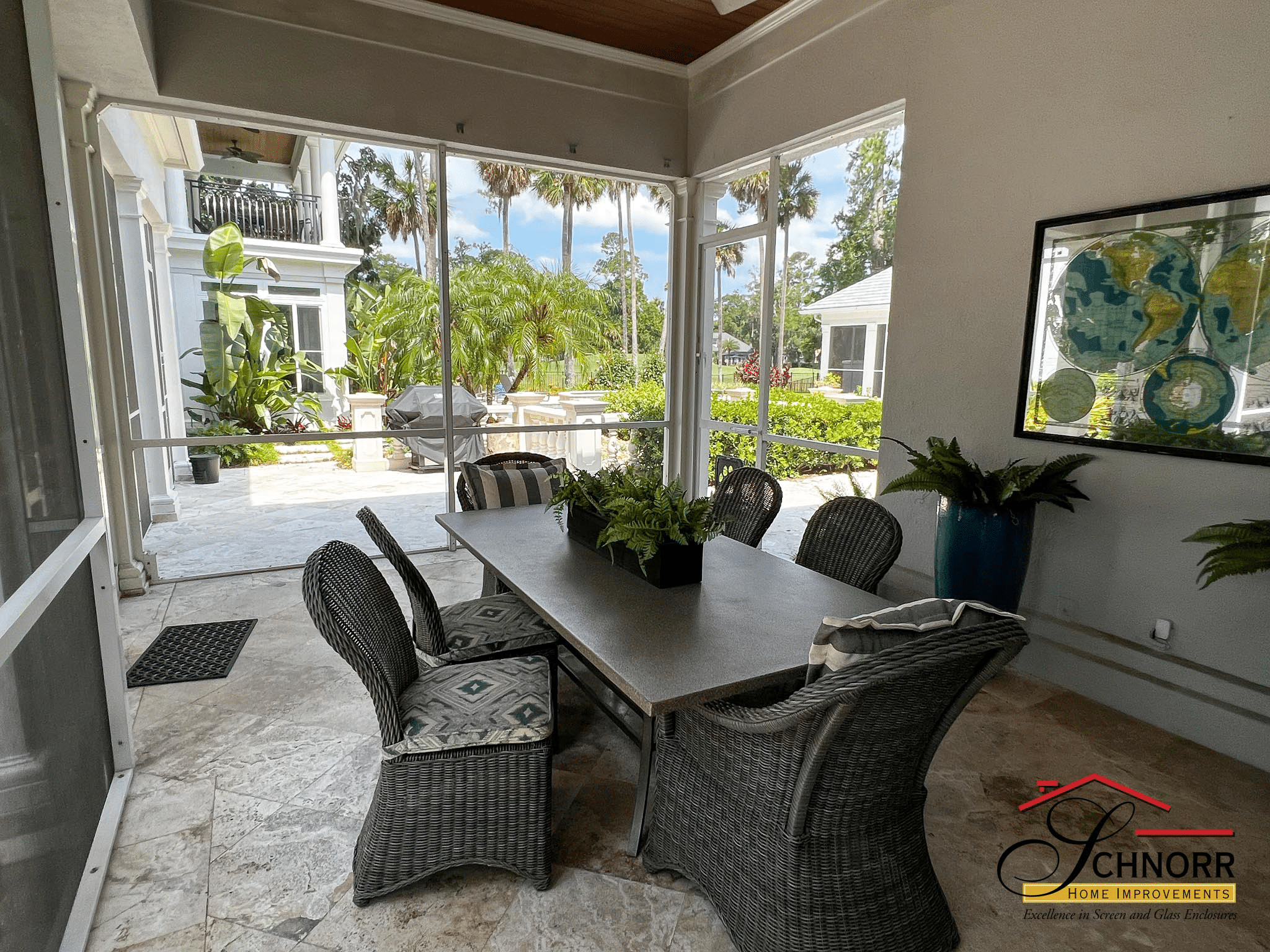 Outdoor kitchen seating area in Jacksonville, FL Covered outdoor kitchen with seating at a Jacksonville, FL home
