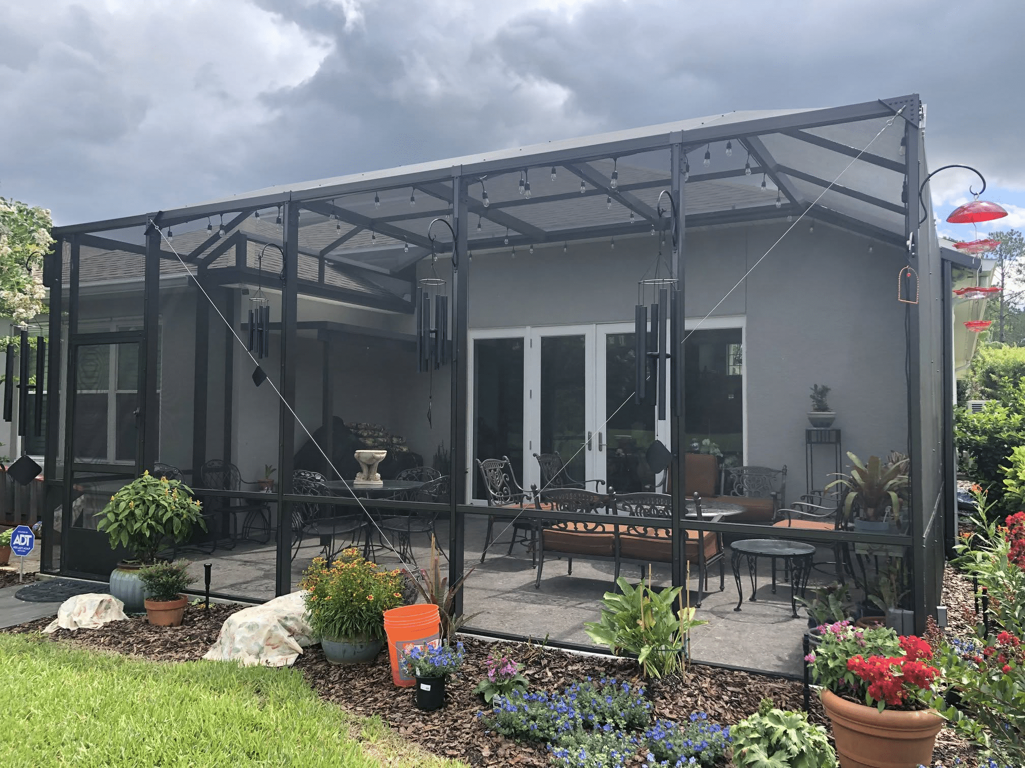 Patio Screen Enclosures Jacksonville FL Patio screen enclosure surrounding an outdoor living space in Jacksonville, FL