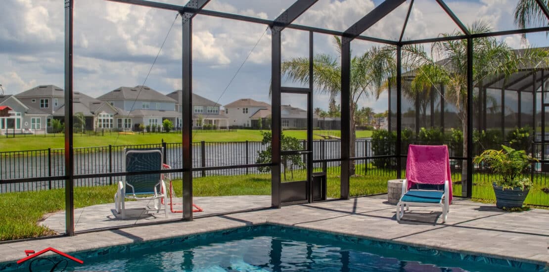Custom pool screen enclosure with screened roof and aluminum framing in Jacksonville, FL