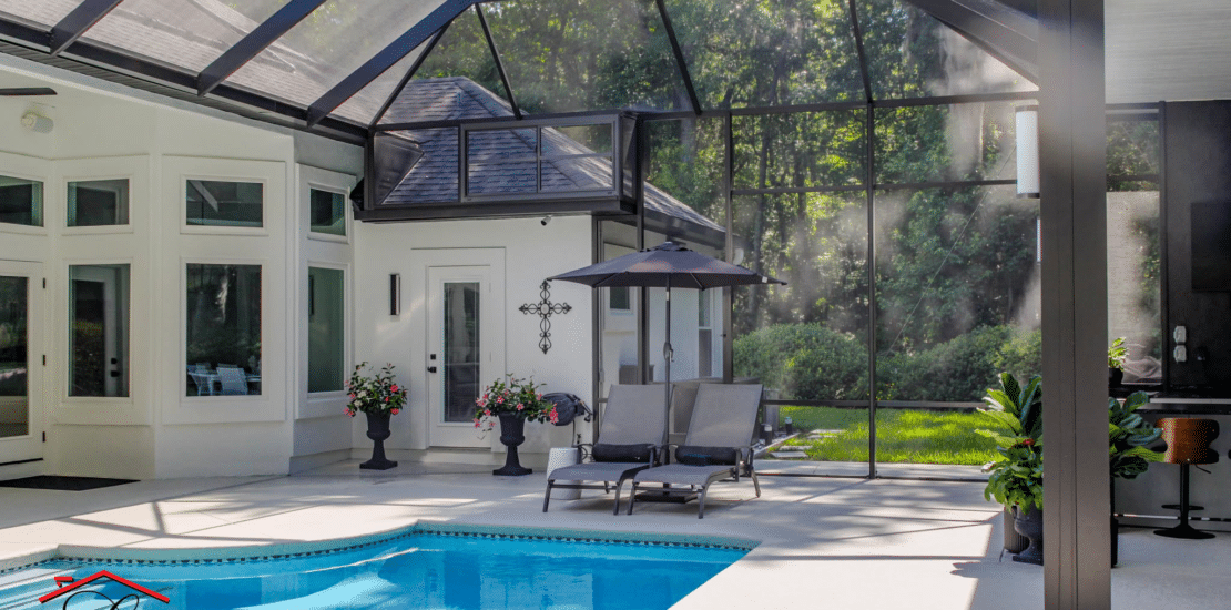 Custom pool enclosure surrounding a backyard swimming pool in Jacksonville, FL